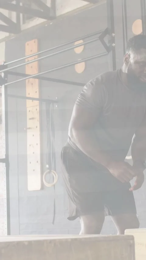 Vertical video: Man stepping into frame adjusting shorts, woman reaching box, Stock Footage 333820992