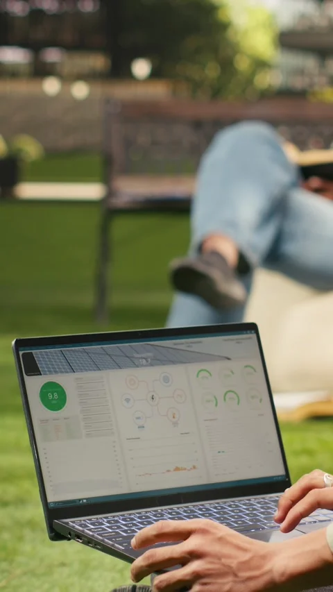 Vertical Video Man student working with solar panels data for sustainable energy Stock Footage 341321180