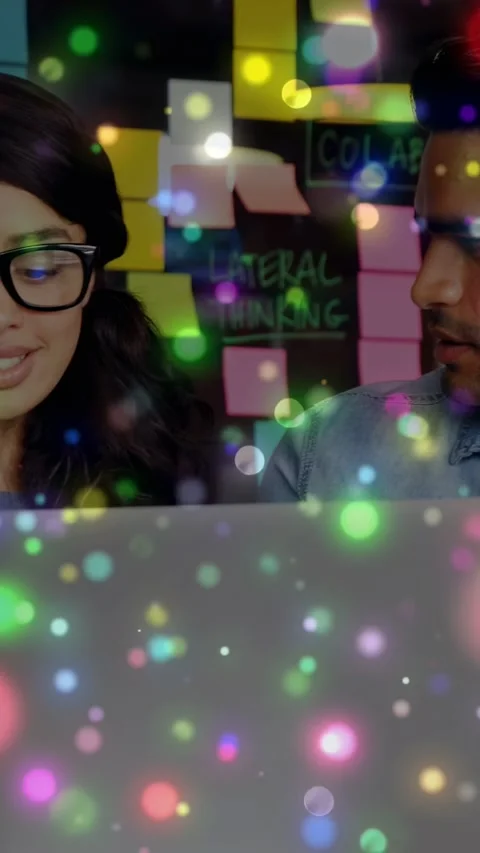 Vertical video: Man studying laptop, woman joining, starting design review, Stock Footage 334694981