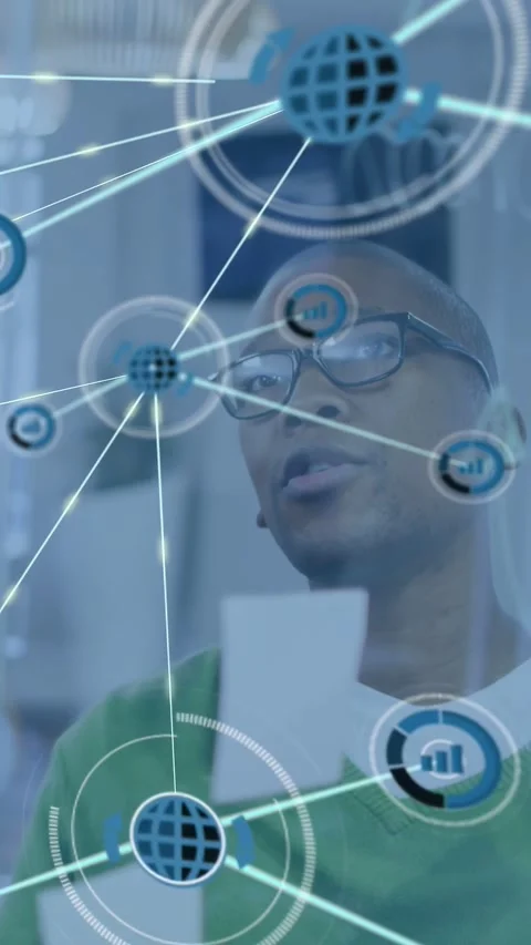 Vertical video: Man studying notes on glass tapping node animating network Stock Footage 332823454