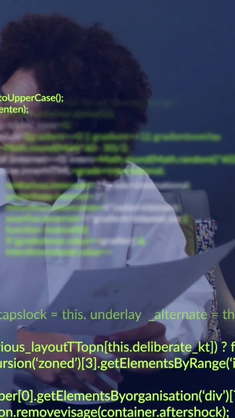 Vertical video: Man studying papers as laptop ping starting green code overlay Stock Footage 330196067