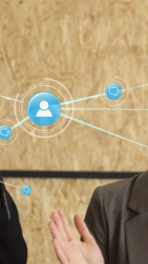 Vertical video: Man tapping blue node in business meeting, showing network Stock Footage 334390720