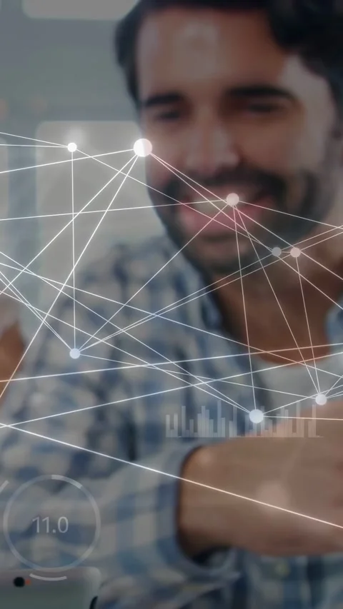 Vertical video: Man tapping device on glass table, nodes tracking face in tech Video stock 333745231