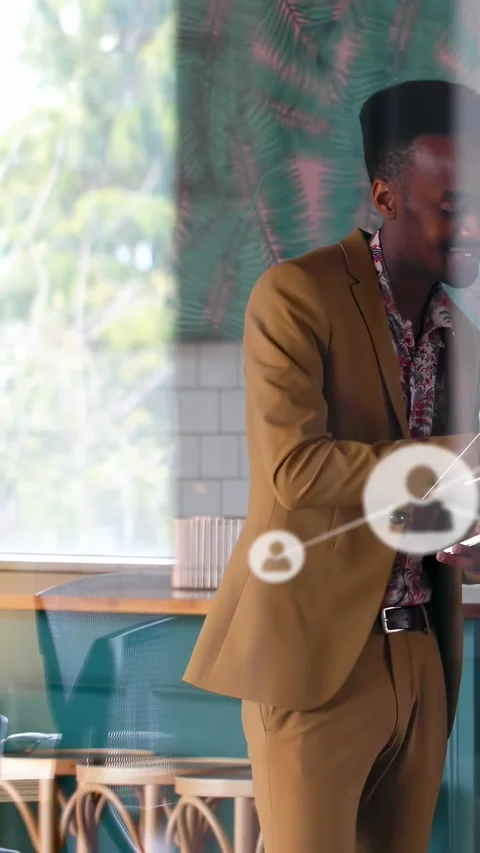 Vertical video: Man tapping device, network icons expanding left and overlaying Stock Footage 334601170