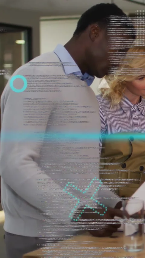 Vertical video: Man tapping docs at desk causing scan line and code over hands Stock Footage 333650055