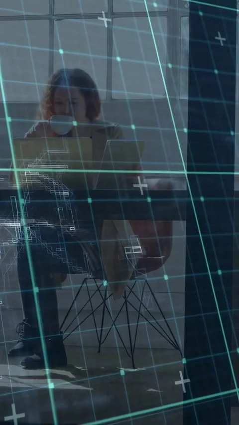 Vertical video: Man tapping laptop, initiating HUD grid scrolling frame while Stock Footage 331271297