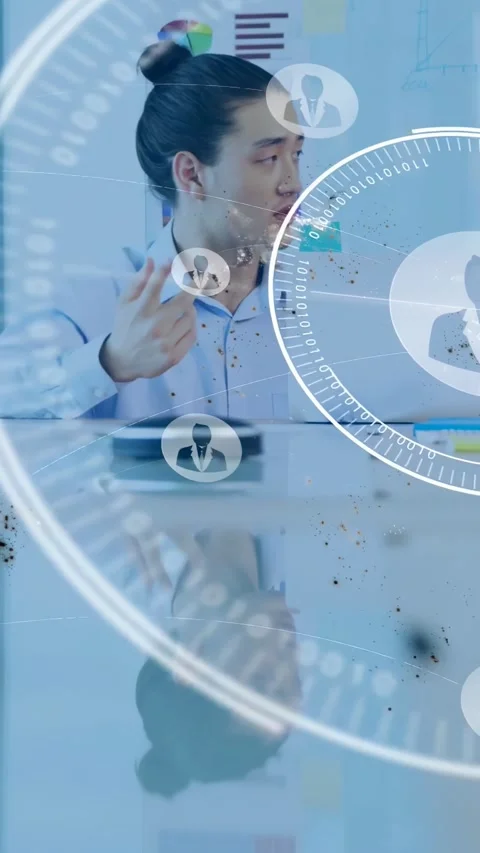 Vertical video: Man tapping laptop, gesturing with HUD expanding, showing Stock Footage 334382480