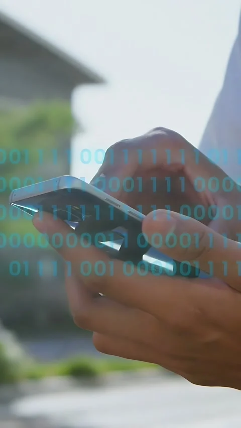 Vertical video: Man tapping phone screen, animating blue binary rows across Stock Footage 333658324