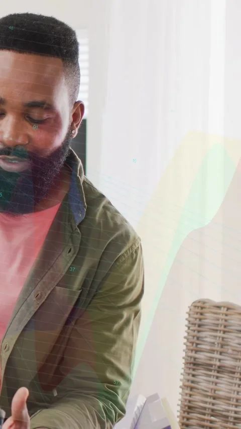 Vertical video: Man tapping phone, opening tech app in living room, colorful Stock Footage 333840081