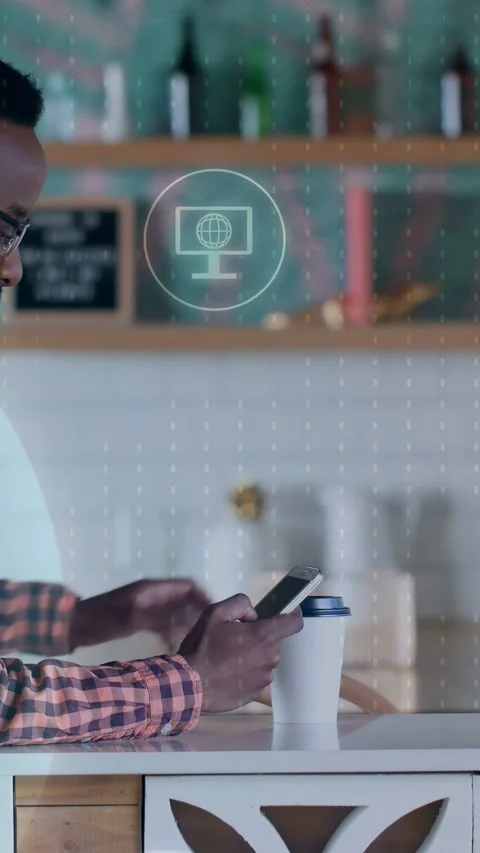 Vertical video: Man tapping phone in cafe, lifting cup, causing tech mail icons Stock Footage 333862241