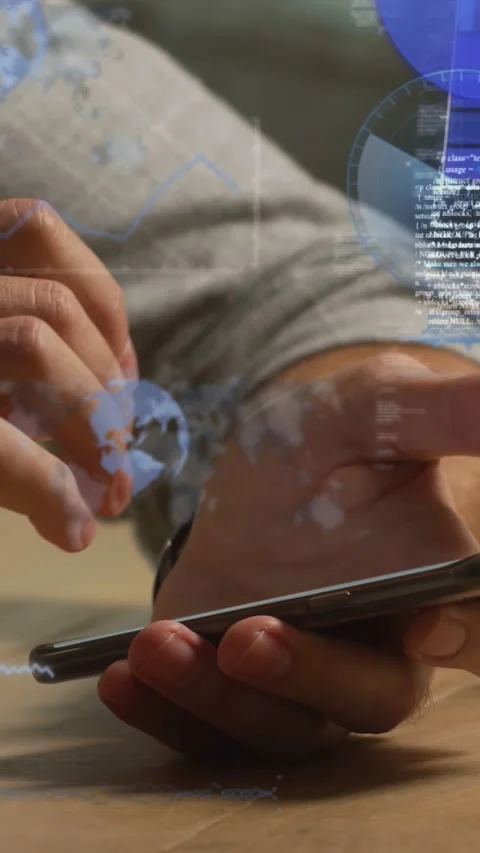 Vertical video: Man tapping phone on table, initiating business data overlays Stock Footage 334423486