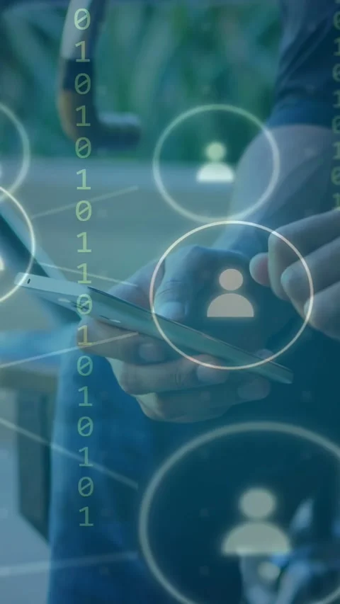 Vertical video: Man tapping phone on porch, animating social icons and binary Stock Footage 335355859