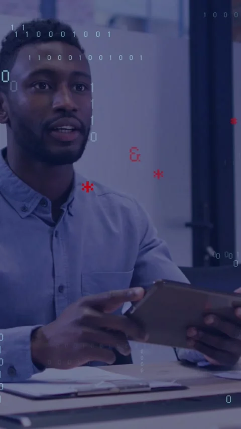 Vertical video: Man tapping tablet in business meeting, code overlay rising over Stock Footage 329934021