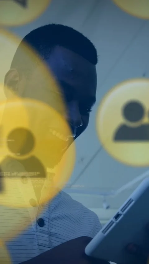 Vertical video: Man tapping tablet, revealing yellow avatars and console text, Stock Footage 329962074