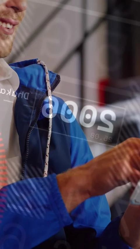Vertical video: Man tapping tablet, activating HUD overlays and reviewing tech Video stock 330430364