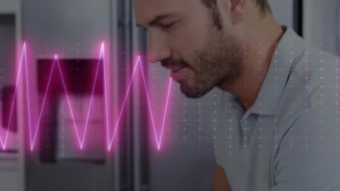 Vertical video: Man tapping tablet causing wave and dot grid on hands sipping Stock Footage 331045822