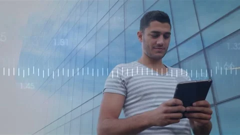 Vertical video: Man tapping tablet, checking tech data while waveform and Stock Footage 332642522
