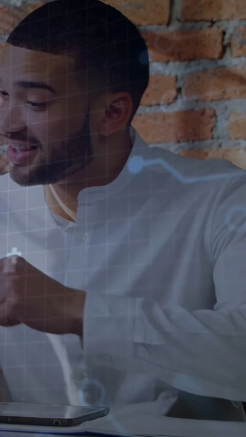 Vertical video: Man tapping tablet, starting coding overlay and charts for code Stock Footage 333556906