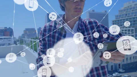 Vertical video: Man tapping tablet on rooftop, visualizing device music nodes Stock Footage 334183044