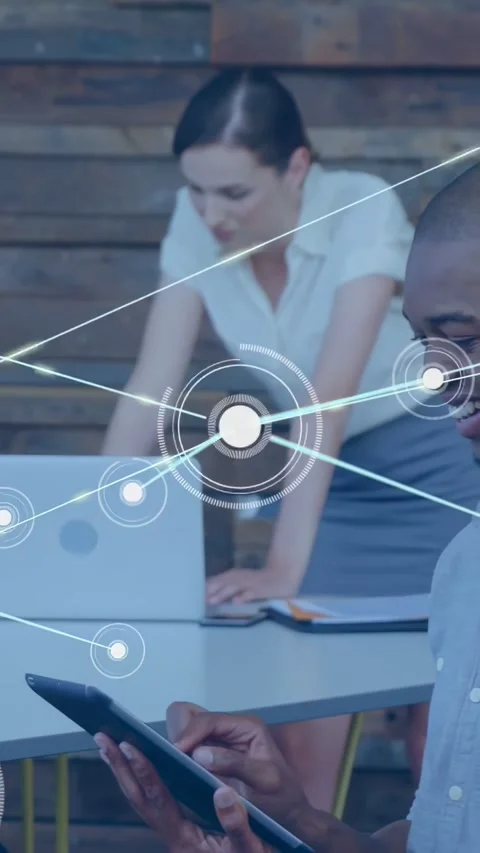Vertical video: Man tapping tablet for demo, UI spreading across tech meeting, Stock Footage 334390652