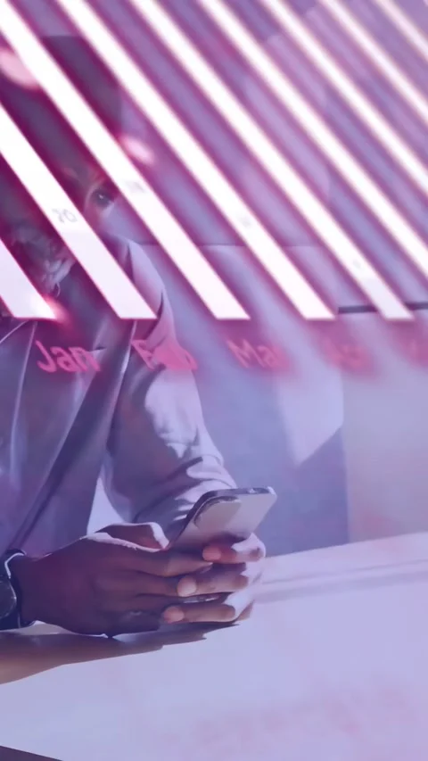 Vertical video: Man on tech phone checking data while AR month-labels, pink-bars Stock Footage 334601146