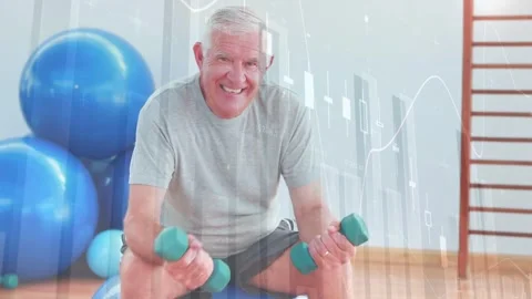 Vertical video: Man in tee curling teal weights on blue ball in gym as overlay Stock Footage 331757286