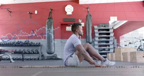 Vertical video: Man tensing core and doing sit-ups on gym mat, waveform tracking Stock Footage 332426139