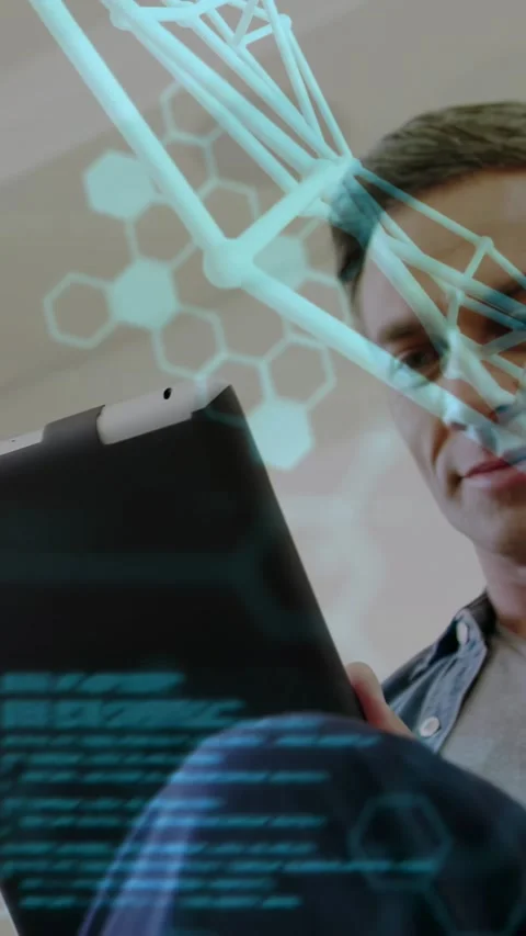 Vertical video: Man tilting tablet and starting AR hex overlay merging with Stock Footage 330542912