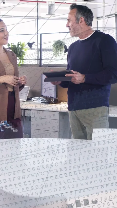 Vertical video: Man tilting tablet, woman asking, causing code and blue chart Stock Footage 334770384