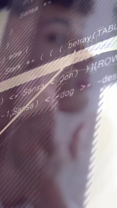 Vertical video: Man touching face as camera panning, code-overlay over face 動画素材 333821628