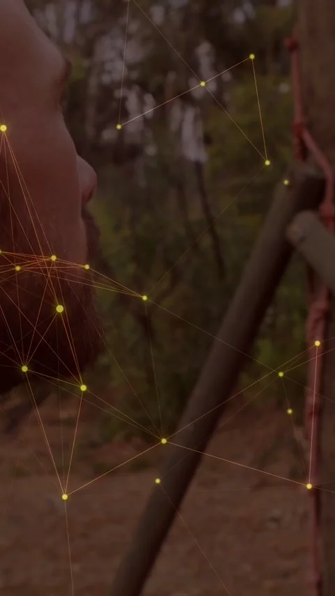 Vertical video: Man turning face as camera sliding in, yellow nodes overlaying Stock Footage 337540855