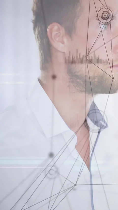 Vertical video: Man turning head toward off-screen prompt while HUD tech graphs Stock Footage 334540852