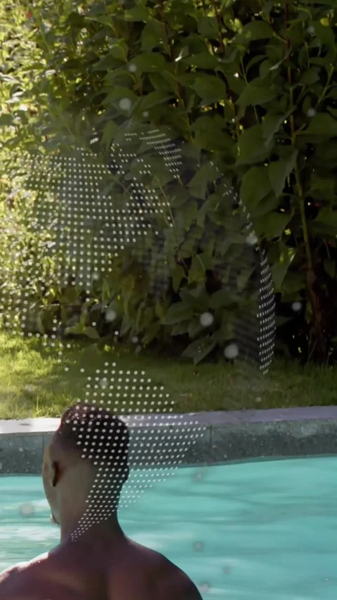 Vertical video: Man turning in pool, dotted graphic drifting past and amplifying Stock Footage 330655767