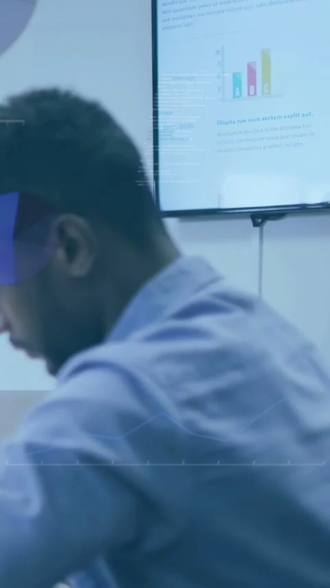 Vertical video: Man turning to tech screen as slide moving, reading bar chart, Stock Footage 333595851