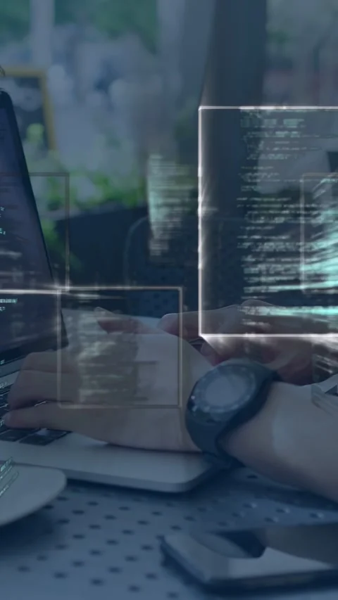 Vertical video: Man typing at cafe while UI boxes appearing from sides Stock Footage 335678032