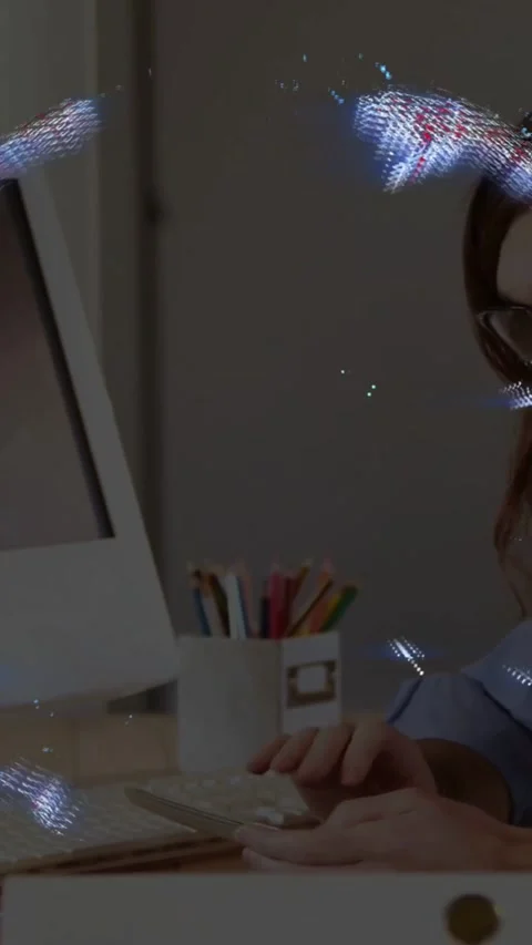 Vertical video: Man typing at desk, data globe overlay moving, breaking, forming Stock Footage 331238574