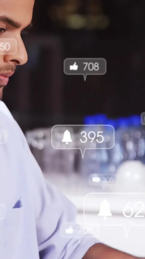 Vertical video: Man typing laptop causing floating likes and comments counts Stock Footage 330858539