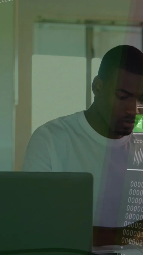 Vertical video: Man typing at laptop, causing code overlay and progress bars for Stock Footage 331738737