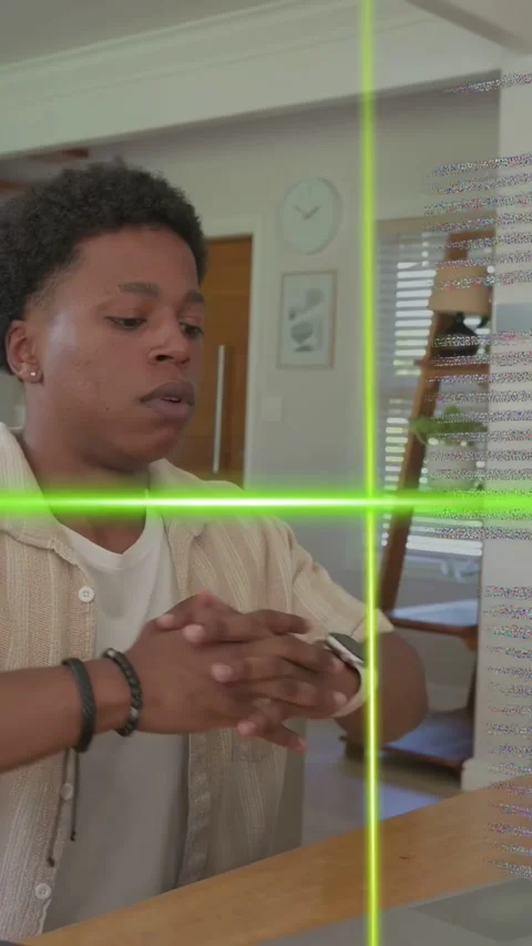 Vertical video: Man typing laptop, HUD line cutting face, making man stretch and Stock Footage 334705035