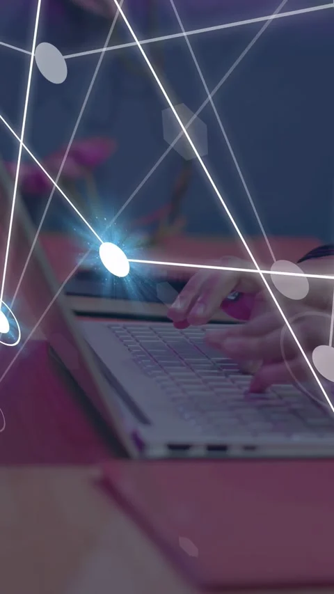 Vertical video: Man typing on laptop keys, starting tech overlay showing data Stock Footage 335355483