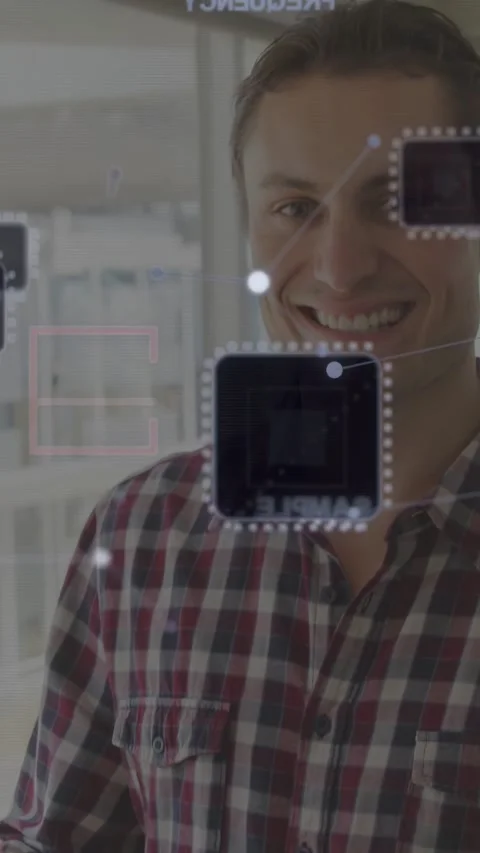 Vertical video: Man typing on laptop starting AR circuit nodes overlay aligning Stock Footage 335513638