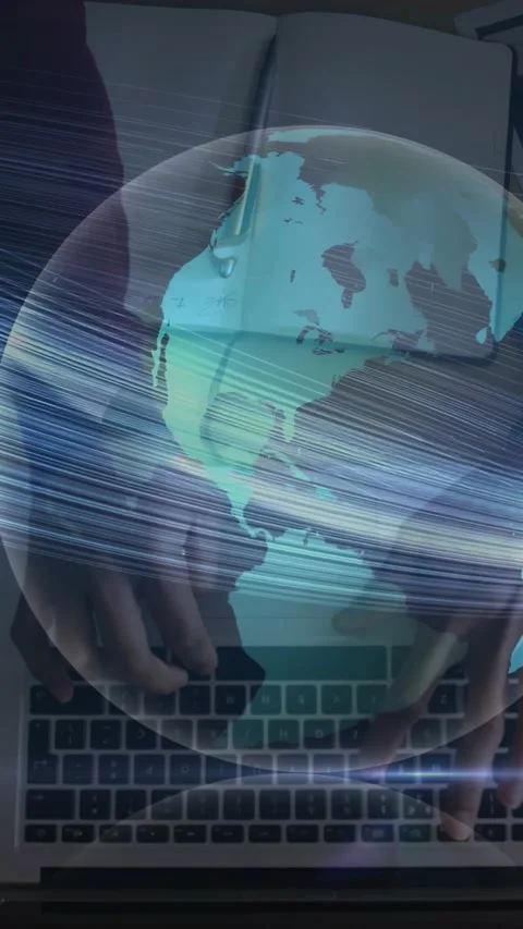 Vertical video: Man typing PC keys starting rotating globe overlaying keys and Stock Footage 331168445