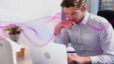 Vertical video: Man typing, reviewing designs while camera revealing him, pink Stock Footage 333463365