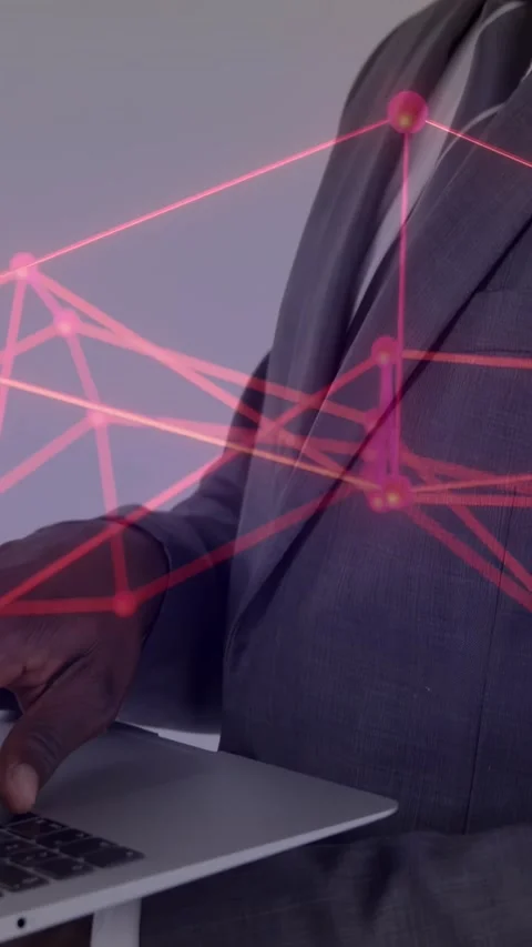 Vertical video: Man typing starting red network overlay, camera pulling back for Stock Footage 334547086