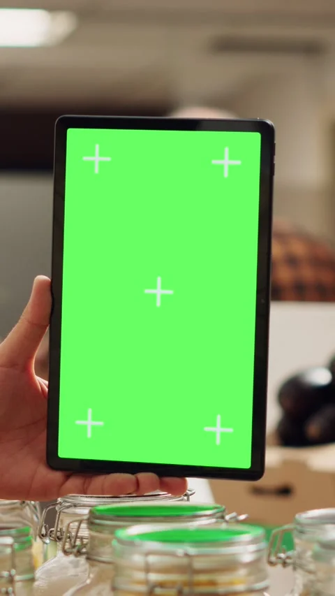Vertical video Man uses isolated screen tablet in shop Stock Footage 252583614