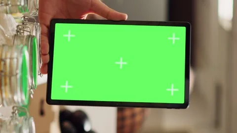Vertical video Man uses isolated screen tablet in shop Stock Footage 252942984