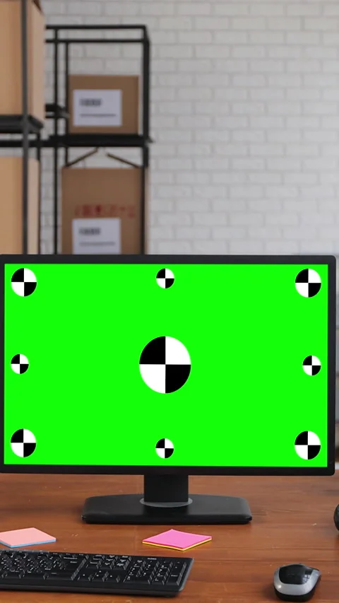Vertical video. Man using desktop computer with green screen chromakey Stock Footage 345739608