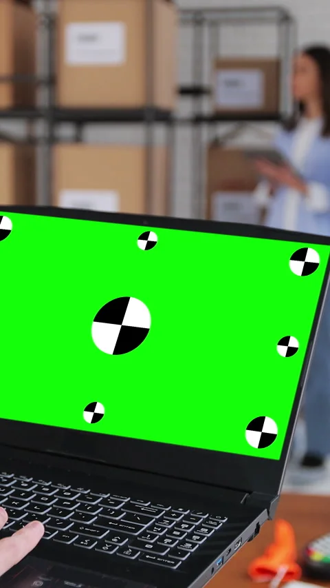 Vertical video. Man using laptop computer with green screen chromakey Stock Footage 345736853