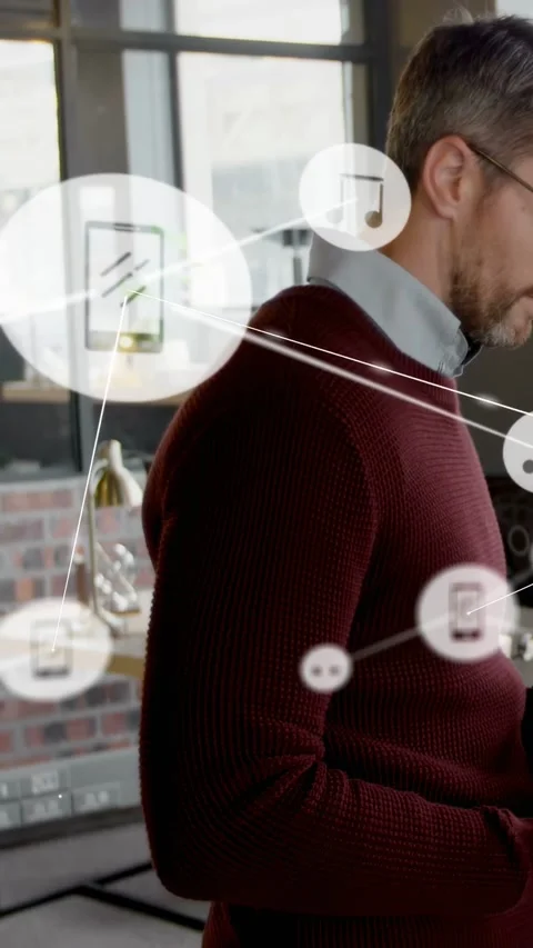 Vertical video: Man using phone causing tech nodes and icons forming data flow Stock Footage 333464878