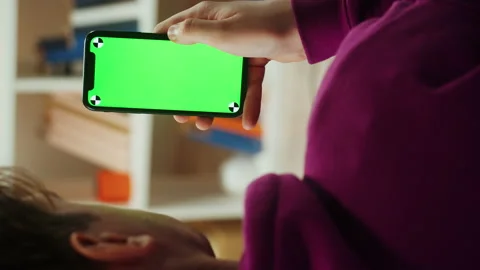 Vertical video of man using smartphone with chroma key close-up. Young guy Stock-Footage 167732738